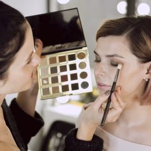 artist-applying-make-up-model