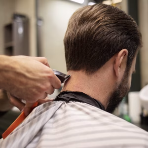bearded-man-getting-his-haircut-barber-s-shop