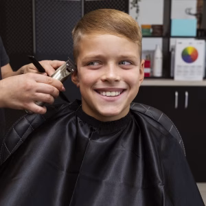 front-view-kid-getting-haircut-salon