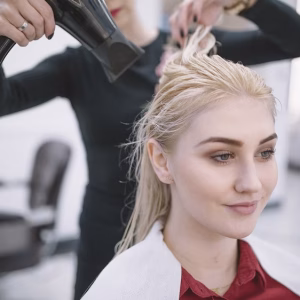 woman-drying-wet-hair-blonde